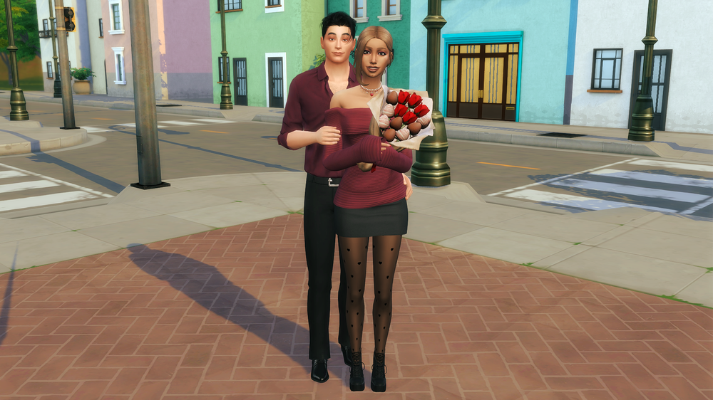 Evan, en chemise bordeaux, enlace Anaïs, en pull bordeaux aux épaules dénudées, jupe noire et collants à cœurs, un bouquet de roses et de fraises au chocolat dans les bras